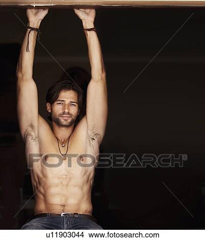 Portrait of man, arms raised View Large Photo Image Picture - Portrait of man, arms raised. Fotosearch