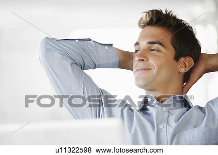 Portrait of man with hands behind head View Large Photo Image Stock Photo - Portrait of man with hands behind head. Fotosearch
