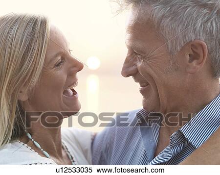 Stock Photography - Portrait of mature couple at sunset. Fotosearch