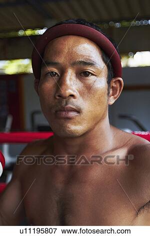 Stock Photo - Portrait of mid adult male boxer. Fotosearch