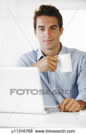 Portrait of mid adult man holding coffee cup View Large Photo Image Stock Photo - Portrait of mid adult man holding coffee cup. Fotosearch