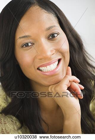 Stock Photo - Portrait of mid adult woman. Fotosearch
