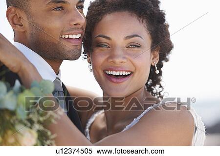 Stock Photography - Portrait of newly wed couple. Fotosearch