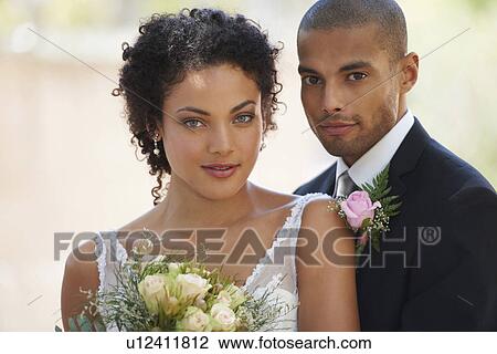 Stock Image - Portrait of newlywed couple. Fotosearch
