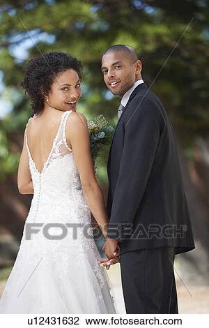 Portrait of newlywed couple View Large Photo Image Stock Image - Portrait of newlywed couple. Fotosearch