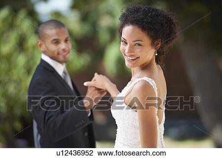 Stock Image - Portrait of newlywed couple. Fotosearch
