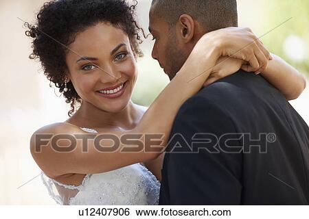 Stock Photograph - Portrait of newlywed couple. Fotosearch
