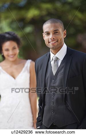Stock Photograph - Portrait of newlywed couple. Fotosearch
