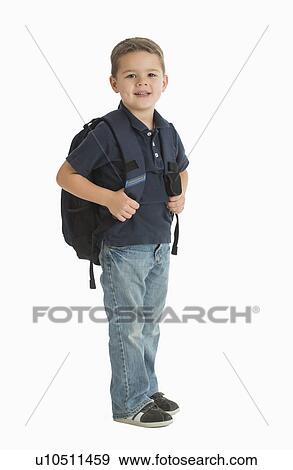 Portrait of schoolboy (4-5) carrying backpack View Large Photo Image Stock Photo - Portrait of schoolboy (4-5) carrying backpack. Fotosearch