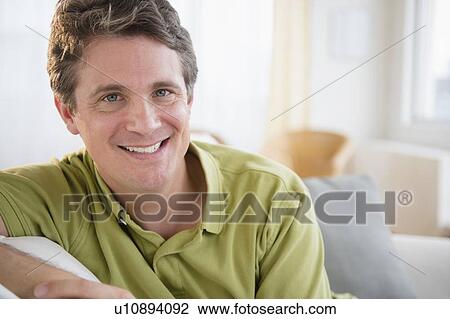 Stock Image - Portrait of smiling man . Fotosearch