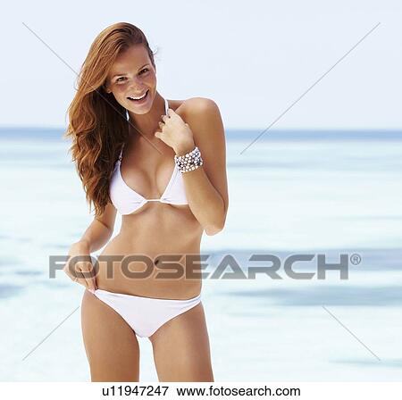 Portrait of smiling young woman in bikini View Large Photo Image Stock Photo - Portrait of smiling young woman in bikini. Fotosearch