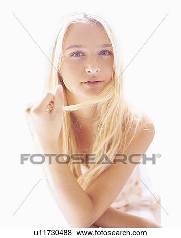 Stock Photo - Portrait of teen (16-17) girl. Fotosearch