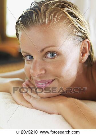 Portrait of woman relaxing in spa View Large Photo Image Stock Image - Portrait of woman relaxing in spa. Fotosearch