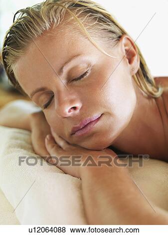 Stock Photo - Portrait of woman relaxing in spa. Fotosearch
