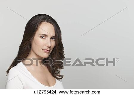 Portrait of woman, studio shot View Large Photo Image Picture - Portrait of woman, studio shot. Fotosearch