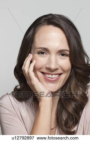 Stock Photo - Portrait of woman, studio shot. Fotosearch
