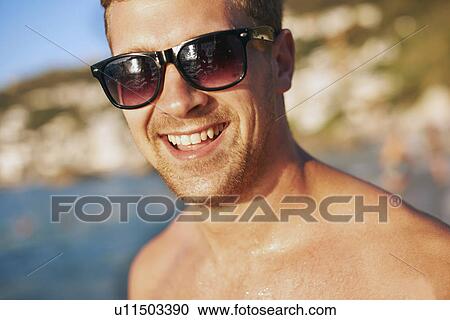 Portrait of young man at beach View Large Photo Image Stock Image - Portrait of young man at beach. Fotosearch
