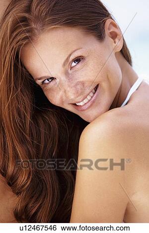 Portrait of young smiling woman View Large Photo Image Stock Photograph - Portrait of young smiling woman . Fotosearch