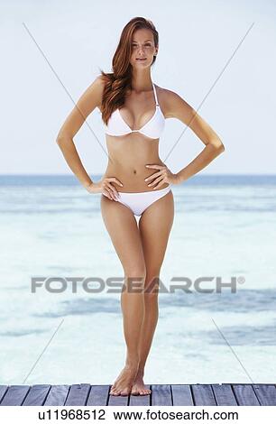 Portrait of young woman in bikini View Large Photo Image Stock Image - Portrait of young woman in bikini. Fotosearch
