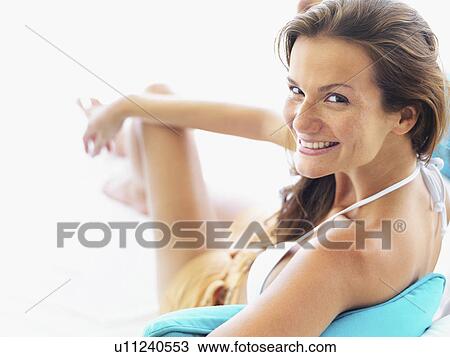 Portrait of young woman relaxing View Large Photo Image Stock Image - Portrait of young woman relaxing. Fotosearch