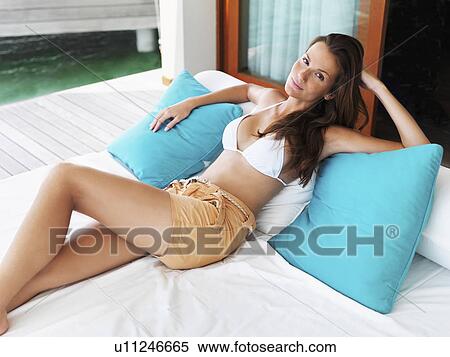 Stock Photography - Portrait of young woman relaxing. Fotosearch