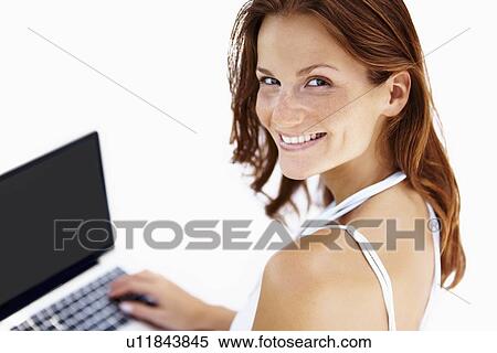 Pretty woman using laptop View Large Photo Image Stock Photography - Pretty woman using laptop. Fotosearch