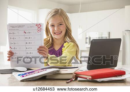 Proud girl (6-7) showing math test View Large Photo Image Stock Image - Proud girl (6-7) showing math test. Fotosearch