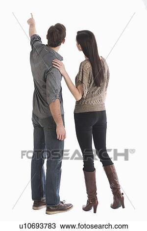 Stock Image - Rear view of couple. Fotosearch