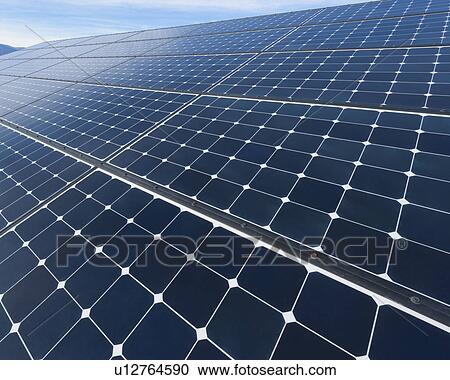 Stock Image - Solar panels on desert. Fotosearch