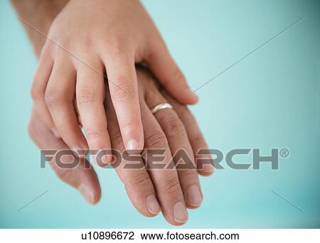 Son (8-9) holding father's hand View Large Photo Image Stock Image - Son (8-9) holding father's hand. Fotosearch