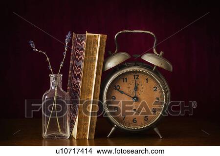 Still life with antique clock and books View Large Photo Image Picture - Still life with antique clock and books. Fotosearch
