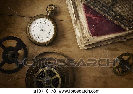 Stock Photo - Still life with pocket watch and gears. Fotosearch