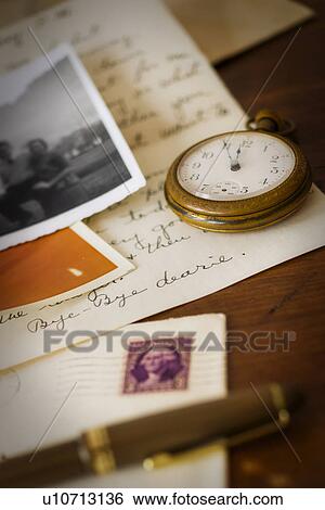 Still life with pocket watch, old letter and photograph View Large Photo Image Stock Photograph - Still life with pocket watch, old letter and photograph. Fotosearch