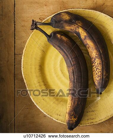Stock Photograph - Still life with rotting bananas . Fotosearch