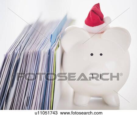 Still life with Santa piggy bank and bills View Large Photo Image Stock Image - Still life with Santa piggy bank and bills. Fotosearch