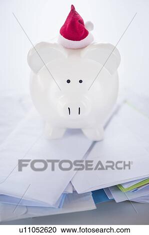 Still life with Santa piggy bank and bills View Large Photo Image Stock Image - Still life with Santa piggy bank and bills. Fotosearch