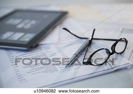 Still life with spectacles, bills and digital tablet View Large Photo Image Stock Image - Still life with spectacles, bills and digital tablet. Fotosearch