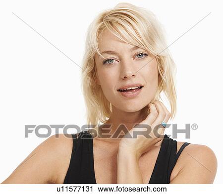 Stock Image - Studio portrait of attractive woman. Fotosearch