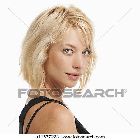 Stock Image - Studio portrait of attractive woman. Fotosearch