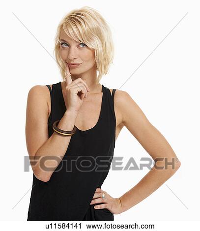 Stock Image - Studio portrait of attractive woman. Fotosearch