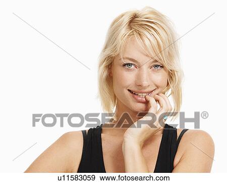 Stock Photo - Studio portrait of attractive woman. Fotosearch