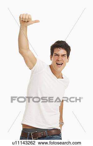 Studio portrait of handsome man cheering View Large Photo Image Stock Image - Studio portrait of handsome man cheering. Fotosearch