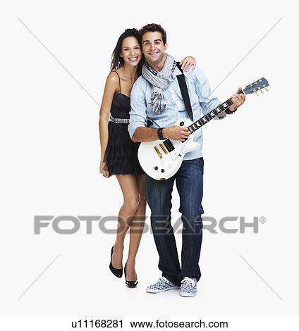 Studio portrait of male guitarist with fan View Large Photo Image Stock Image - Studio portrait of male guitarist with fan. Fotosearch