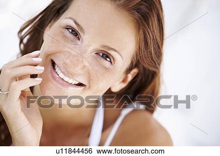 Stock Photograph - Studio portrait of pretty woman. Fotosearch