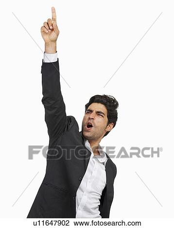 Stock Image - Studio portrait of stylish man cheering. Fotosearch