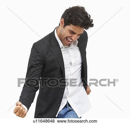 Studio portrait of stylish man cheering View Large Photo Image Stock Photo - Studio portrait of stylish man cheering. Fotosearch