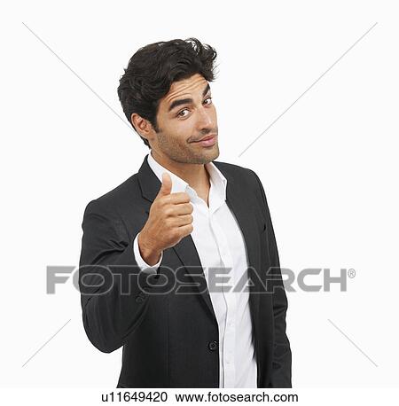 Stock Image - Studio portrait of stylish man gesturing. Fotosearch