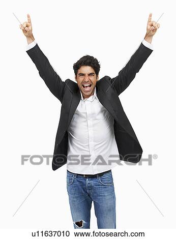 Studio portrait of stylish man celebrating View Large Photo Image Stock Image - Studio portrait of stylish man celebrating. Fotosearch