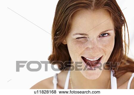 Studio portrait of winking woman View Large Photo Image Stock Photo - Studio portrait of winking woman. Fotosearch