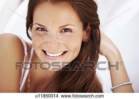 Picture - Studio portrait of woman smiling. Fotosearch
